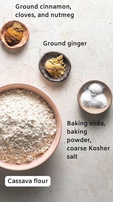 Ingredient image for the Gluten Free Gingerbread Bundt Cake. This image shows Cassava flour, baking soda, baking powder, salt, ginger, cinnamon, cloves, and nutmeg