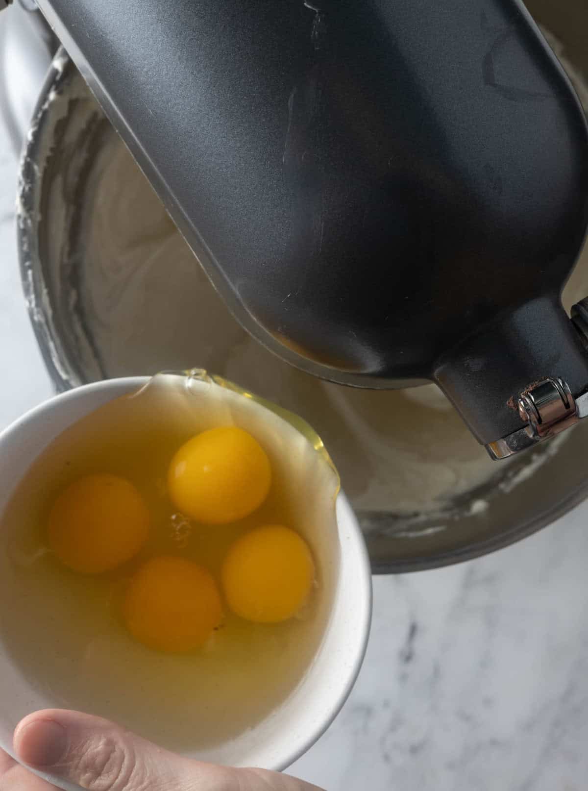 Adding in eggs, vanilla and salt for gluten free oreo cheesecake.
