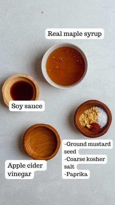Ingredients for mustard maple sauce. This includes 4 bowls filled with maple syrup, soy sauce, apple cider vinegar, ground mustard seed, salt, and paprika