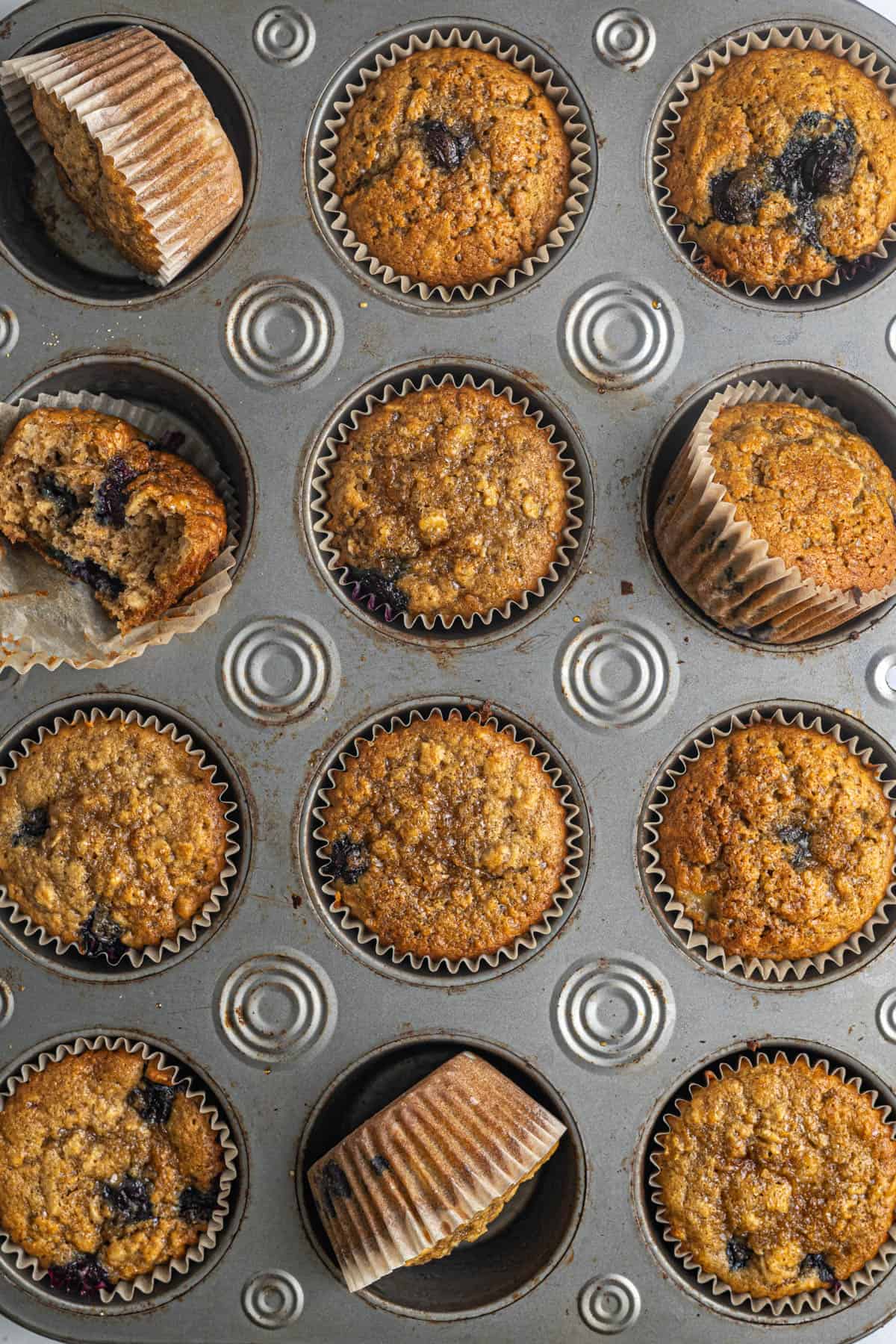 This image shows the finished Blueberry Banana Oat Muffins. They have been baked and are cooling.