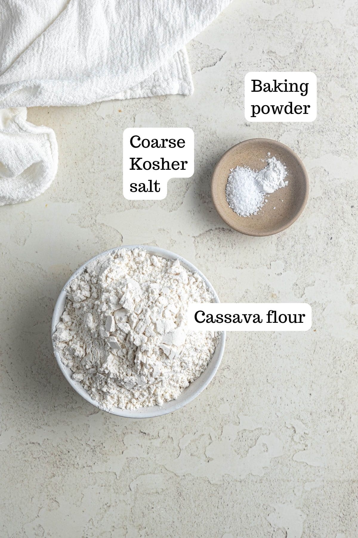 Image showing bowls of dry ingredients for White Chocolate Raspberry Blondies. In the bowls, there is baking powder, salt, and cassava flour.
