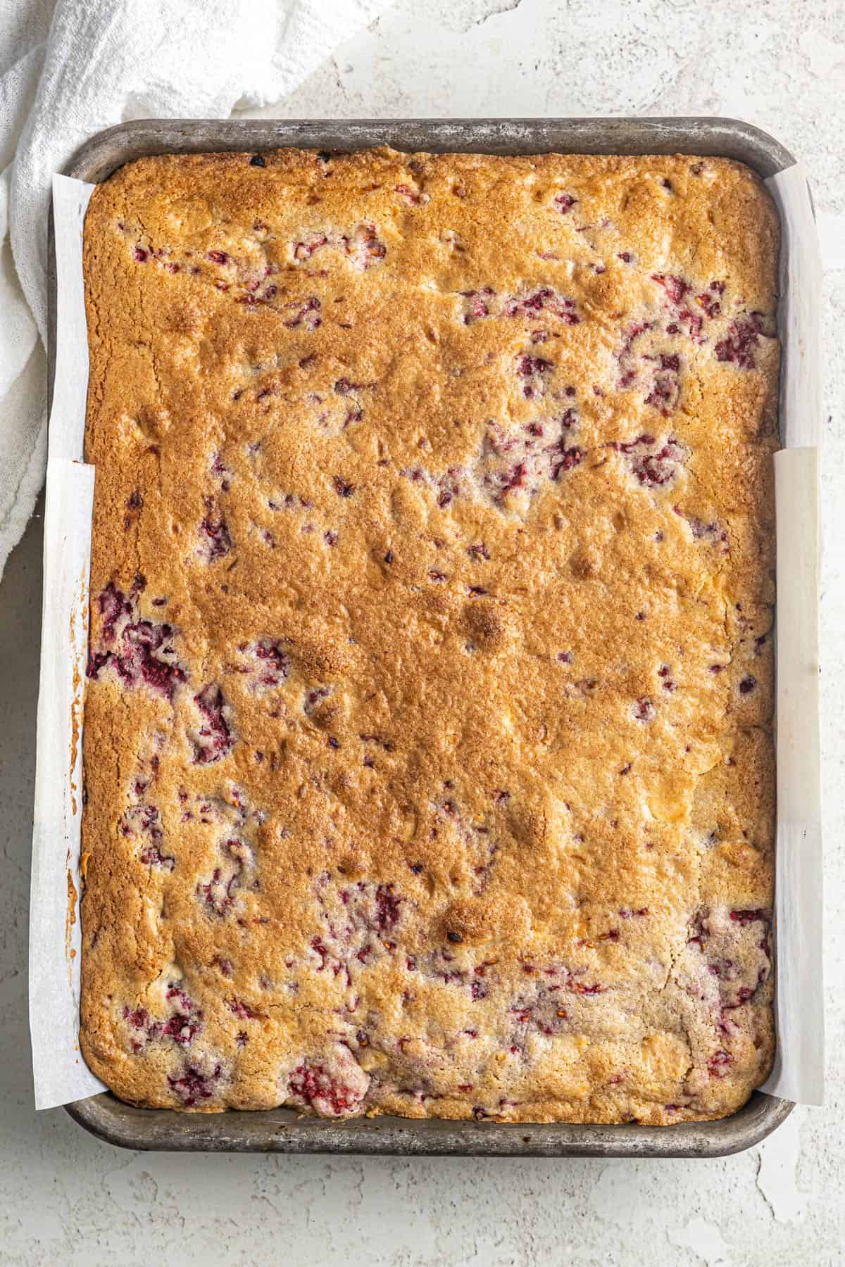 Image shows a finished stack of white chocolate raspberry blondies.