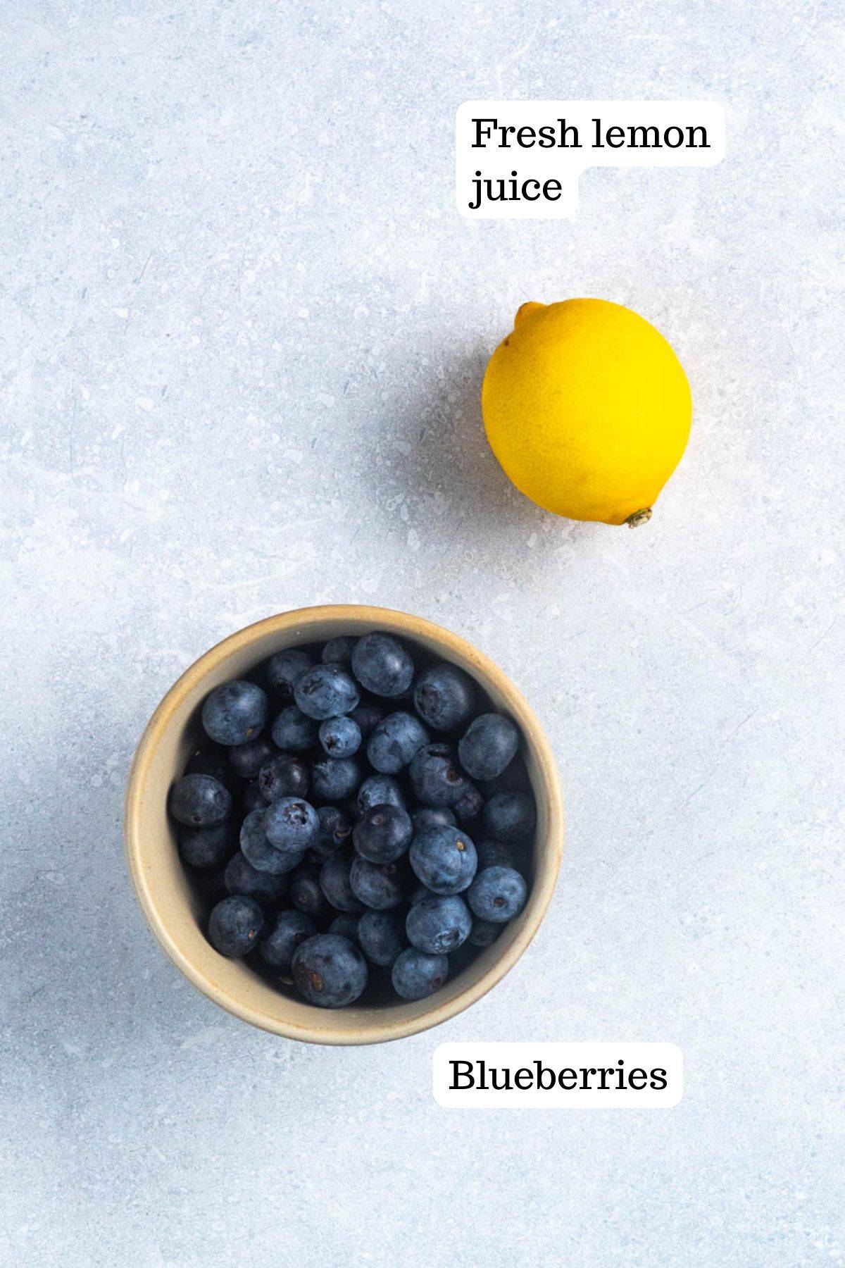 This image shows the fresh lemon and fresh blueberries before they are placed in a pot to cook down for the blueberry frosting.