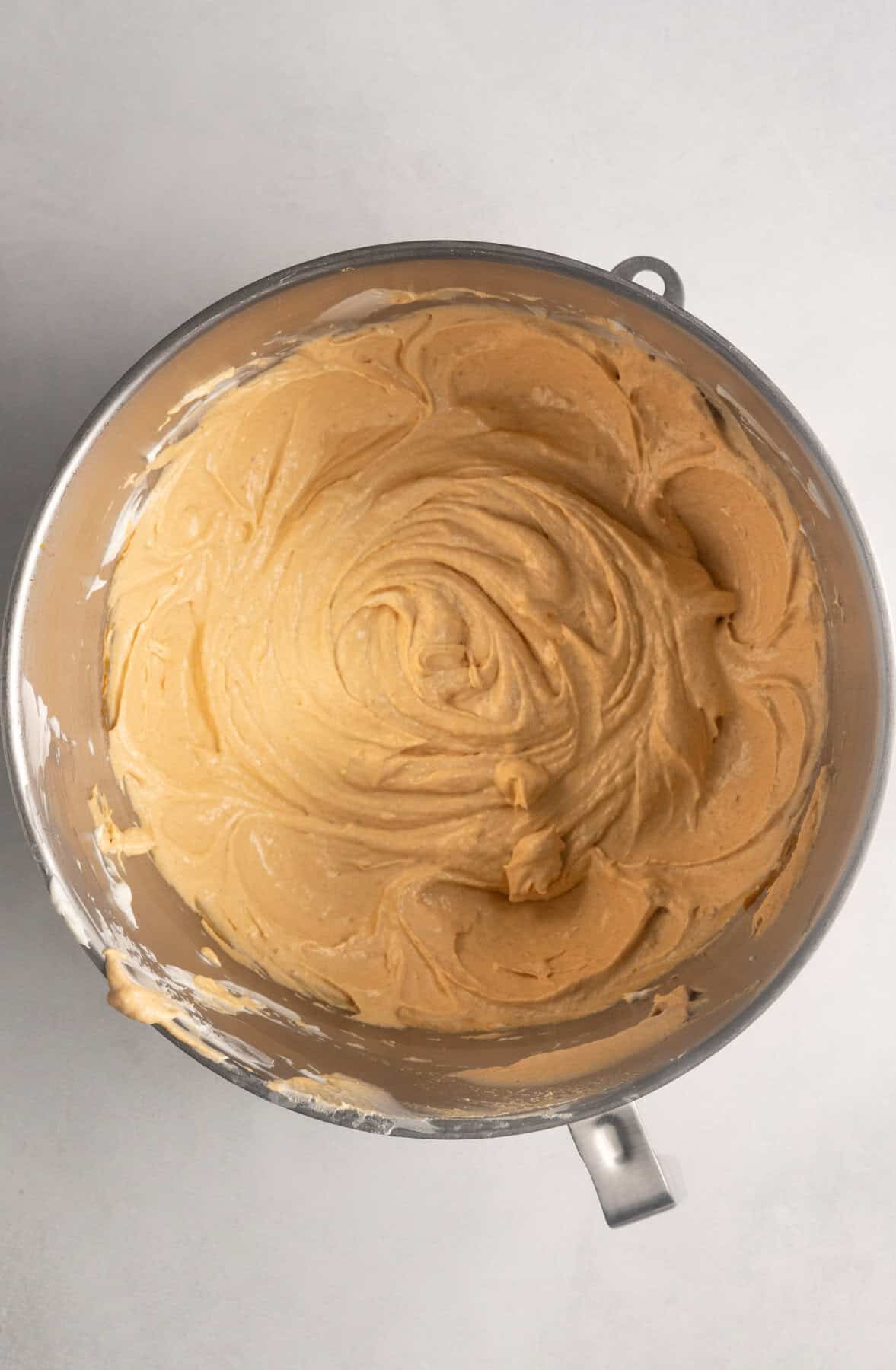 The pumpkin puree for gluten free pumpkin cheesecake has been added to the mixture.