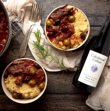 Finished Italian Braised Beef and Olives, served over Creamy Polenta and with Cakebread Cellars Pinot Noir