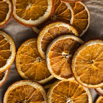 A close up image of the fully dried orange slices in how to make dried orange slices