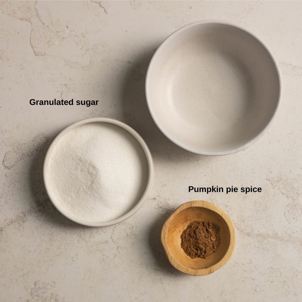 Sugar and pumpkin pie spice ingredient image for gluten free pumpkin cheesecake cookies