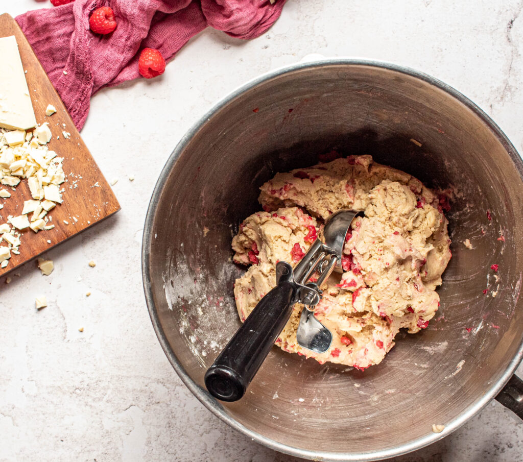 Finished white chocolate raspberry cookie dough, waiting to be scooped 