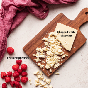 Ingredient image with chopped white chocolate and raspberries